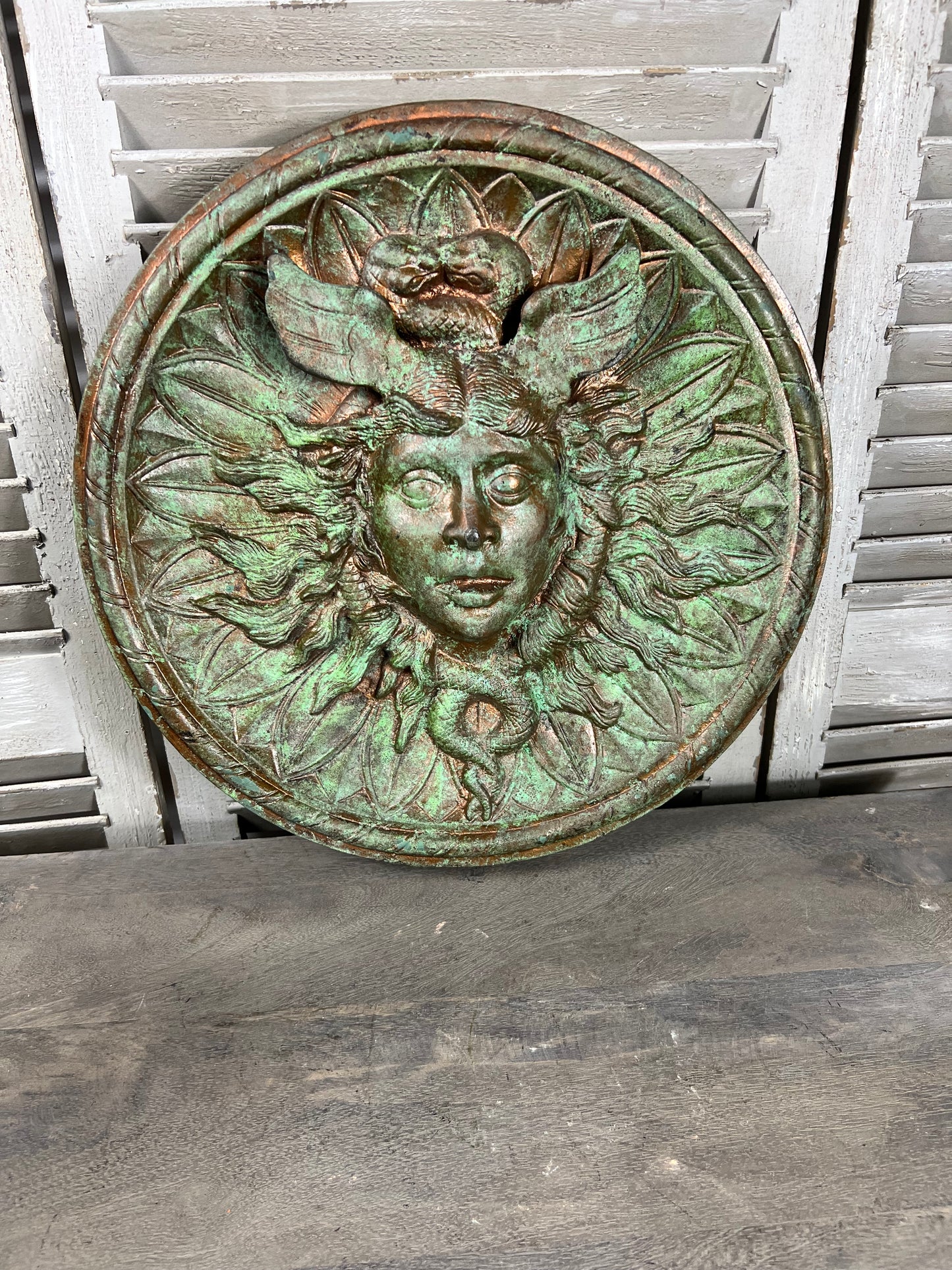 Bronze colour cast aluminium roundel wall decoration
