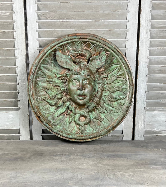 Bronze colour cast aluminium roundel wall decoration