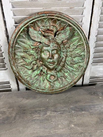 Bronze colour cast aluminium roundel wall decoration