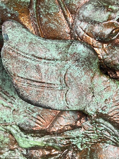 Bronze colour cast aluminium roundel wall decoration