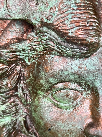 Bronze colour cast aluminium roundel wall decoration