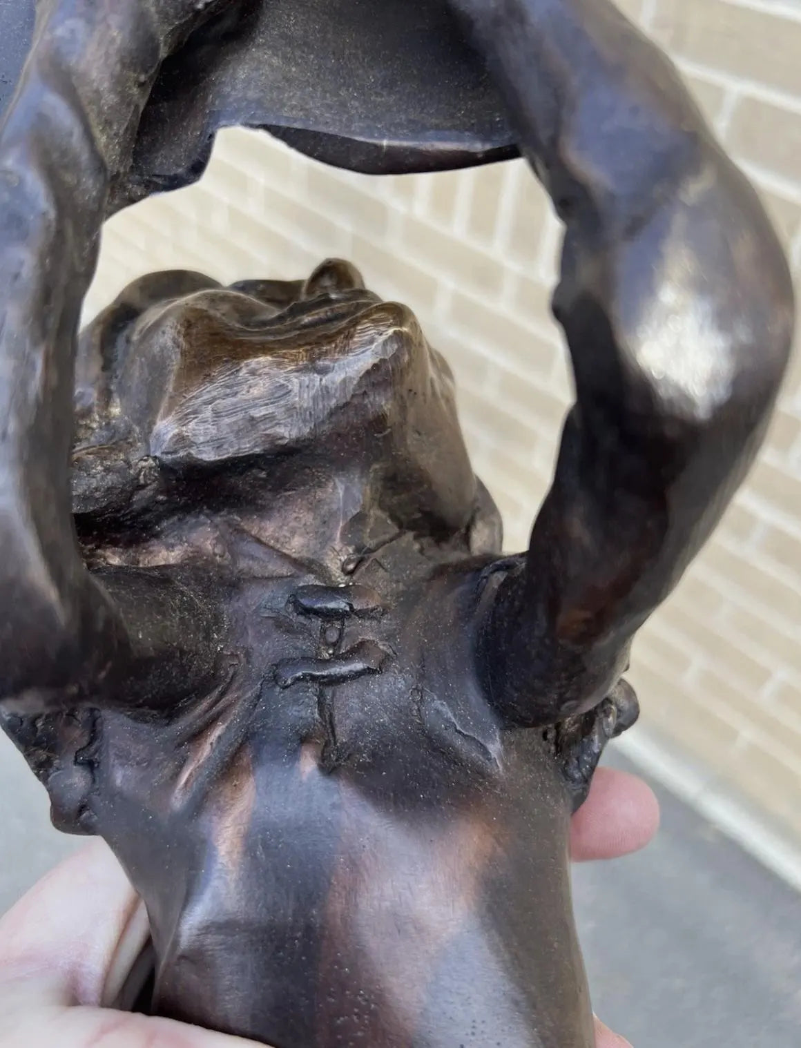 Bronze laying pixie reading